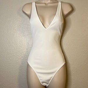 Vestique plunging neck & low back white ribbed bodysuit